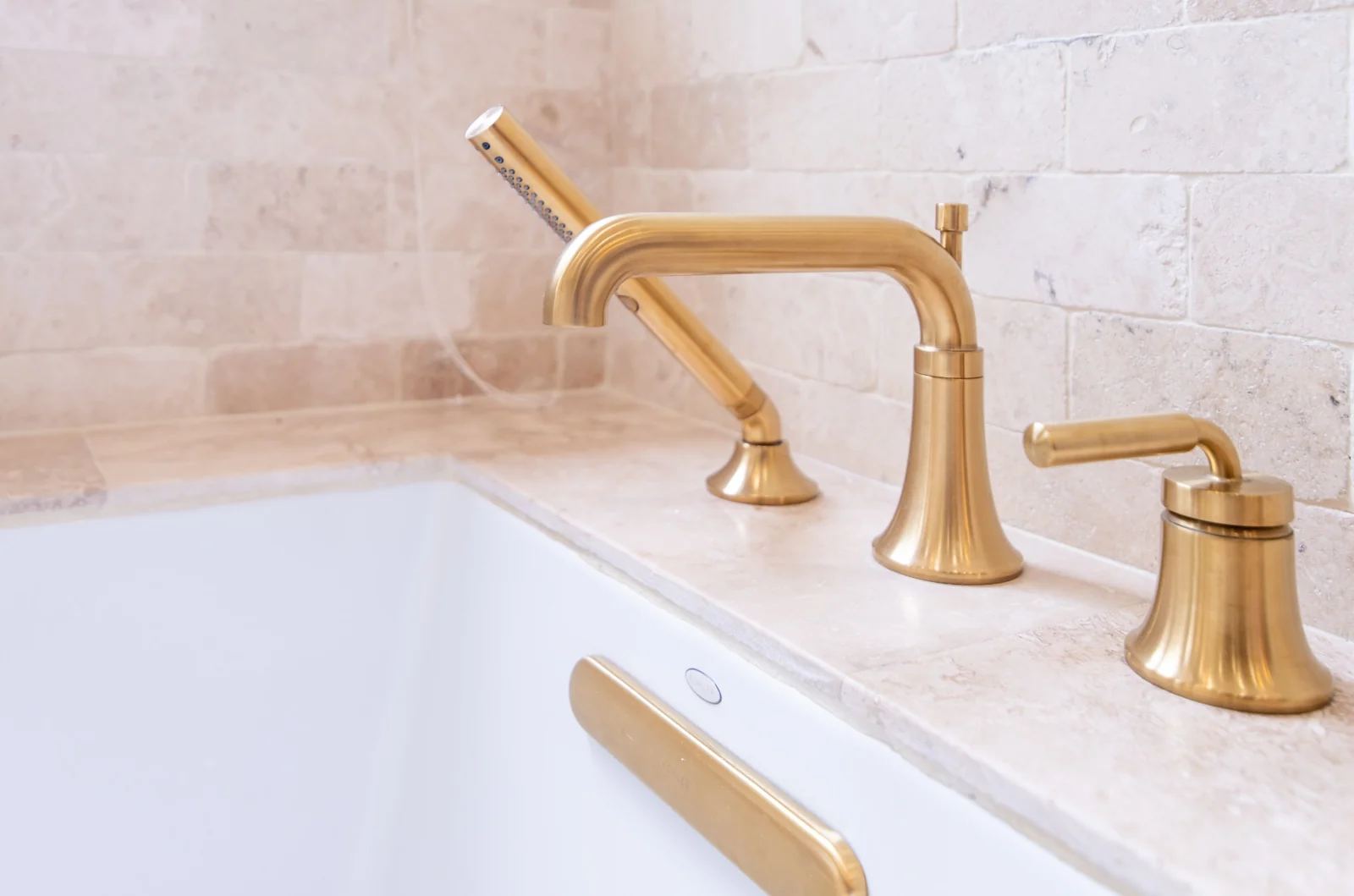 Brass fittings beside the soaking tub