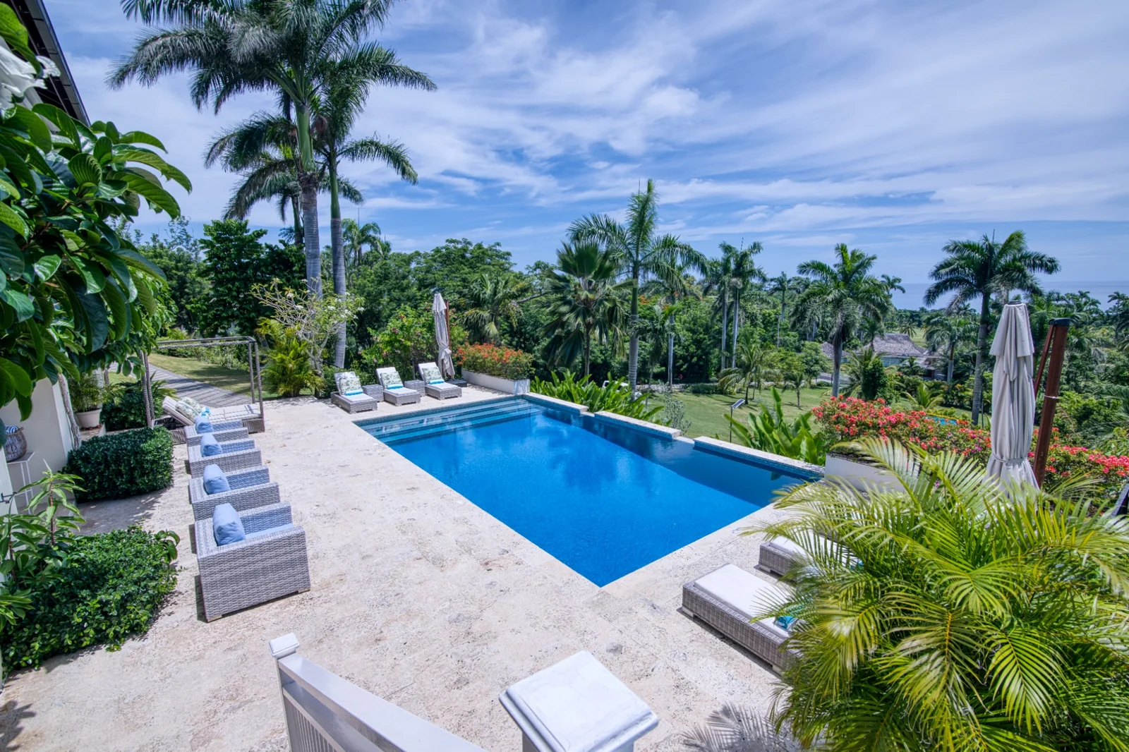Pool and tropical gardens in daylight