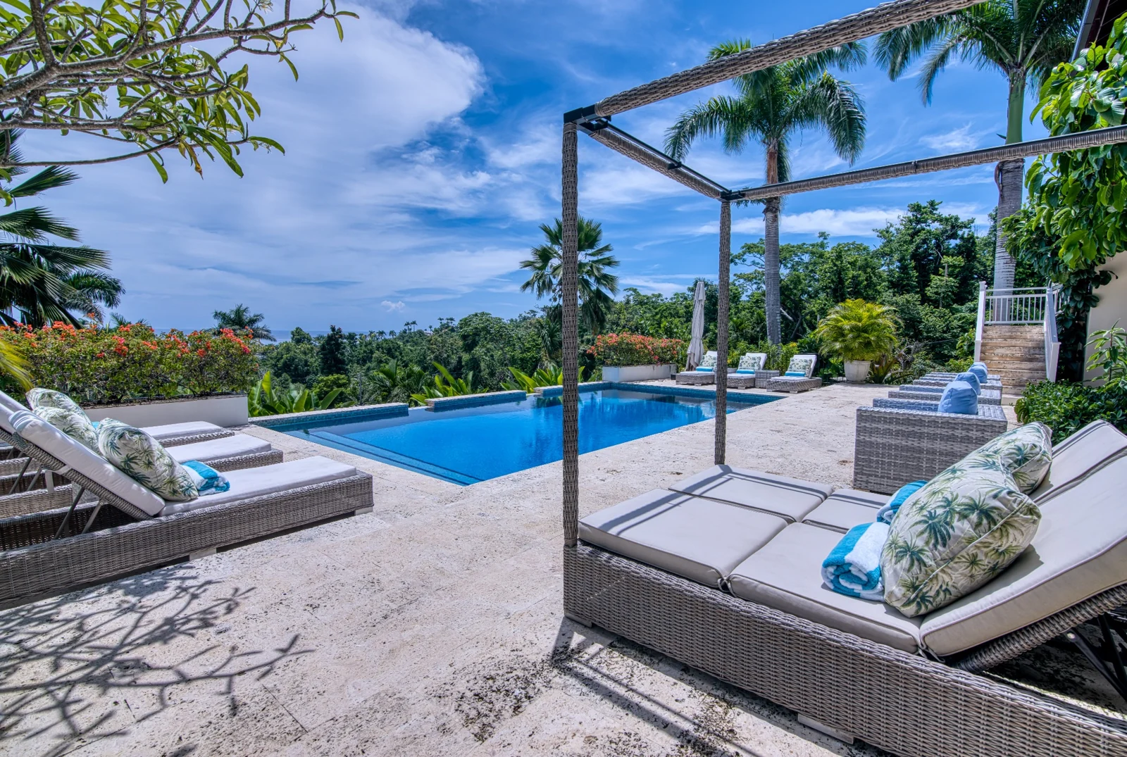 Poolside daybed and garden views